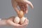 Hands with four hens eggs.