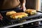 hands-free cheese sandwich melting on a griddle