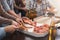 Hands of friends taking slices of tasty pizza at home