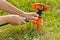 Hands of gardener installing lawn sprinkler