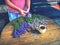 Hands of gardener woman create relaxing smell herbal bouquet.