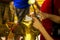 The hands of the girl close the gold plate on Buddha.