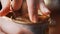 Hands of girl with difficulty open lid of tin can with canned green olives