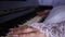 Hands of a girl playing the piano. close-up. female fingers play a keyboard musical instrument. music business.