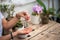 The hands of the girl touch the handmade jewelry. Girl and jewelry. Handmade woman decorating stones close up