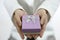 hands giving box with white ribbon. winter holidays  christmas  new year  surprise. small gives present in box Person holds gift