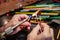 Hands of the glassmaker, shaping figurines from murano glass.