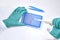 Hands in gloves assemble PCR reaction for DNA analysis