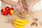 hands of the grandmother and hand of the granddaughter stir ingredients