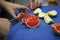 Hands of a grapefruit cutting chef