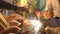 Hands of guests lighting sparklers at a party, close-up