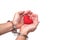 Hands with handcuffs holding a red heart