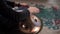 Hands with hang drum close up, man practicing meditation music