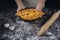 Hands hold black plate with Adjarian Khachapuri â€“ Georgian cheese bread. Baked open pie with cheese and egg yolk filling