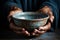 Hands hold empty bowl, portraying the harshness of hunger and economic hardship