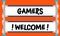 Hands hold inscription: Gamers welcome