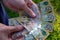 Hands holding australian dollars 50 banknotes to make a payment