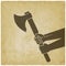 Hands holding axe on vintage background