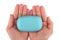 Hands holding blue soap bar with wash your hands written