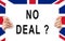 Hands holding a board `No Deal` UK flag background, brexit concept