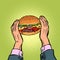 Hands holding a Burger. fast food restaurant