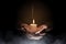 Hands holding candle over dark background