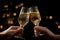 Hands holding champagne glasses for cheers or giving a toast, clinking glasses at party, celebrating and congratulations concept,