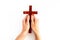 Hands holding christian wooden cross. Faith and prayer concept