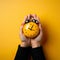 hands holding a clock against a solid background, embodying the concept of time.