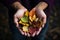 hands holding a collection of colorful autumn leaves,