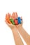 Hands holding colorful clay people