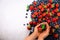 Hands holding fresh berries. Healthy clean eating, dieting, vegetarian food, detox concept. Close up of woman hands over