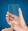 Hands holding futuristic transparent mobile phone