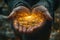 Hands holding glowing sparkle light on dark background.