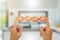 Hands holding happy smiling eggs on blurred kitchen background