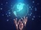 Hands Holding Holographic World Globe Over Blue Background, Cropped