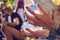 Hands holding juggling crystal balls at public summer festival