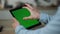 Hands holding mockup tablet close up. Guy touching green screen swiping zooming.