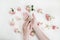 Hands holding natural soap bar with flowers on white background. Spa, Bath, Hygienic concept. Top View, Flatlay