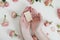 Hands holding natural soap bar with flowers on white background. Spa, Bath, Hygienic concept. Top View, Flatlay