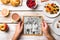 Hands holding picture of seniors, breakfest meal. Studio shot.