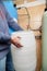 Hands holding  plastic container in water treatment room