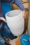 Hands holding  plastic container in water treatment room