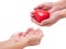 Hands holding a red heart give to hand, CSR or Corporate Social Responsibility, health care, family insurance