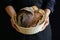 Hands holding rustic breads