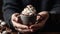 Hands holding a steaming cup of coffee with whipped cream and chocolate shavings created with Generative AI