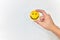 Hands holding a yellow smiley face on white background. Be positive and share happiness concept