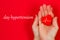 hands holiding red heart. World Hypertension Day