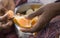 Hands of Indian woman peeling tangerine