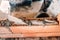 hands of industrial bricklayer installing bricks on construction site